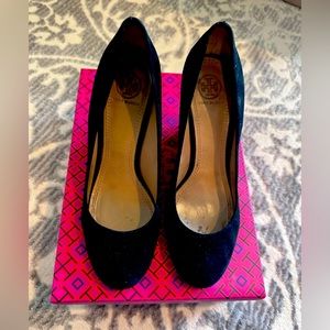 TORY BURCH black suede wedge with gorgeous gold heel detail.